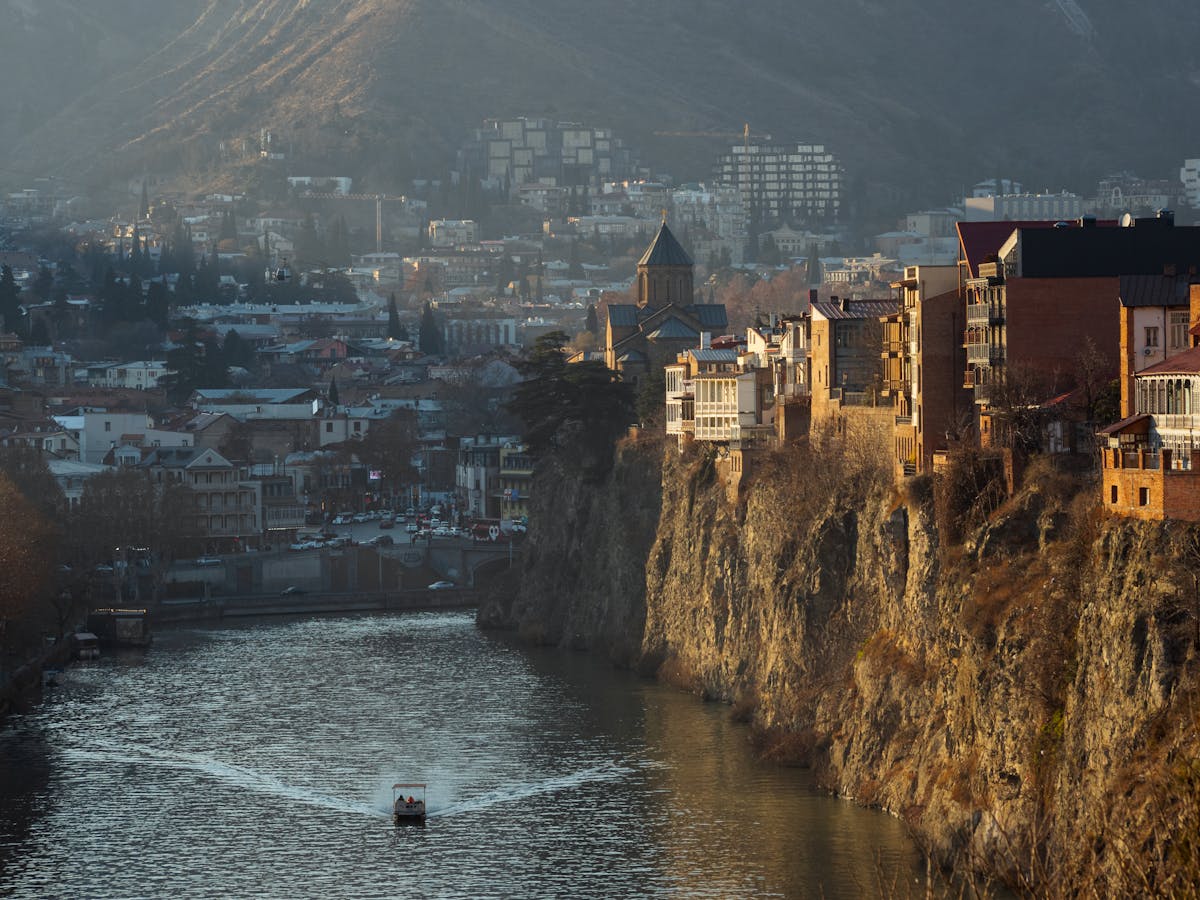 View of Metekhi Church on the cliff above the Mtkvari River in Tbilisi Old Town