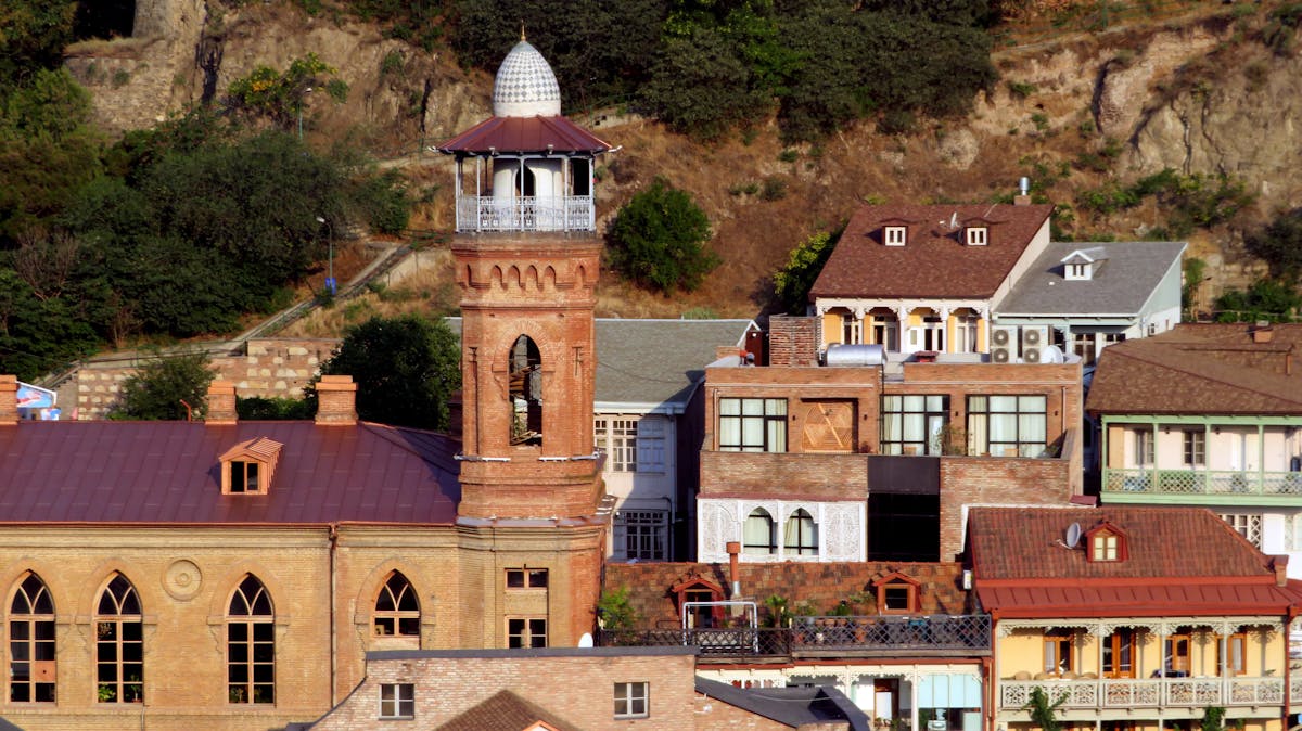 Juma Mosque minaret rising above the rooftops of Abanotubani district in Tbilisi