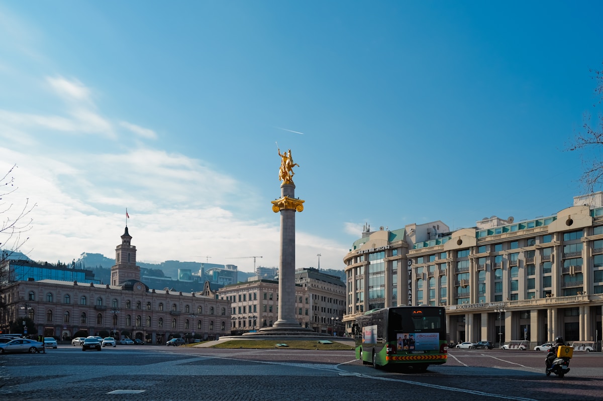 Freedom Square in Tbilisi with the golden Freedom Monument and Saint George statue